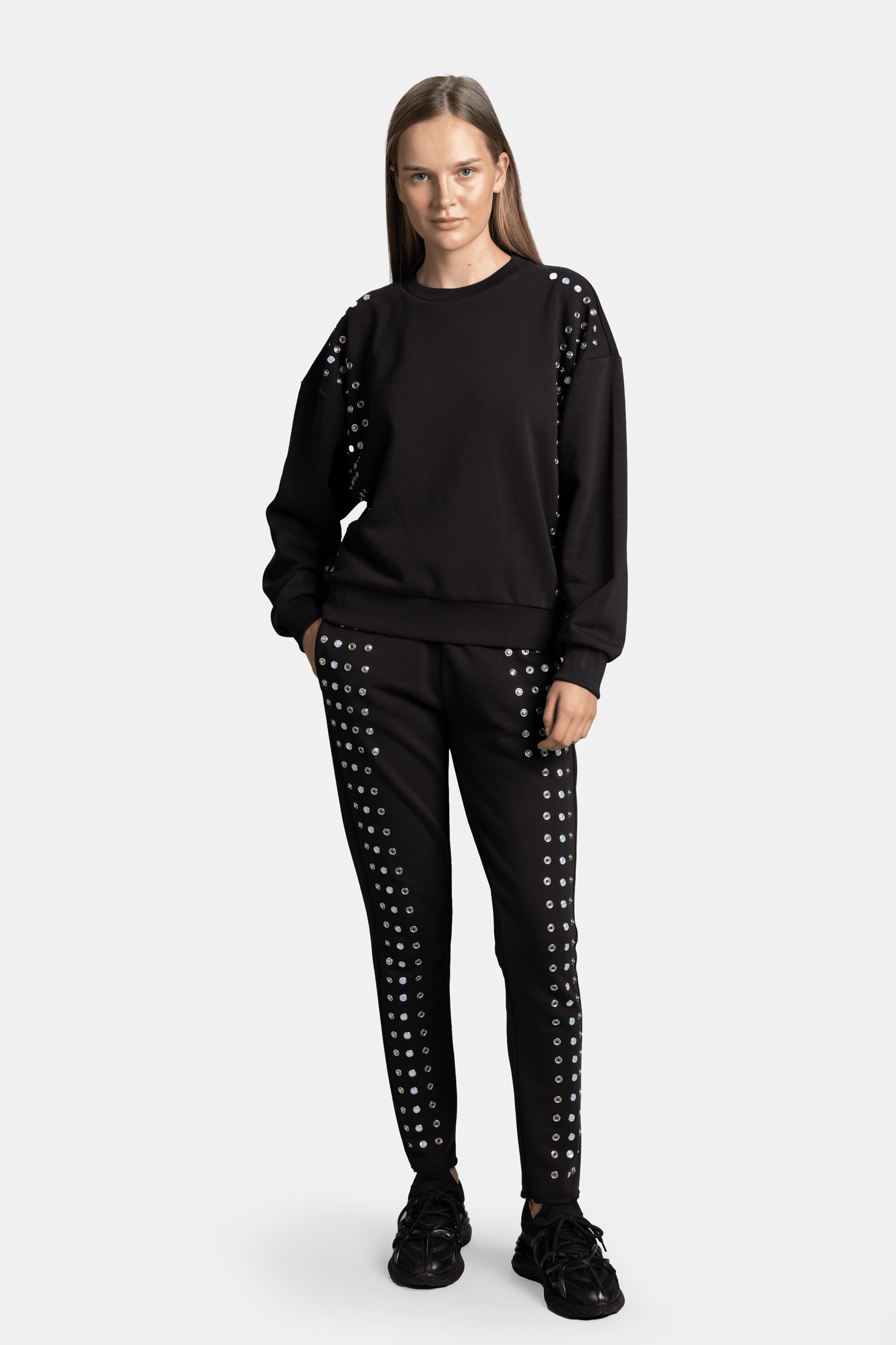 Amaya - Studded Tracksuit Set, front view showcasing studded details on black tracksuit.