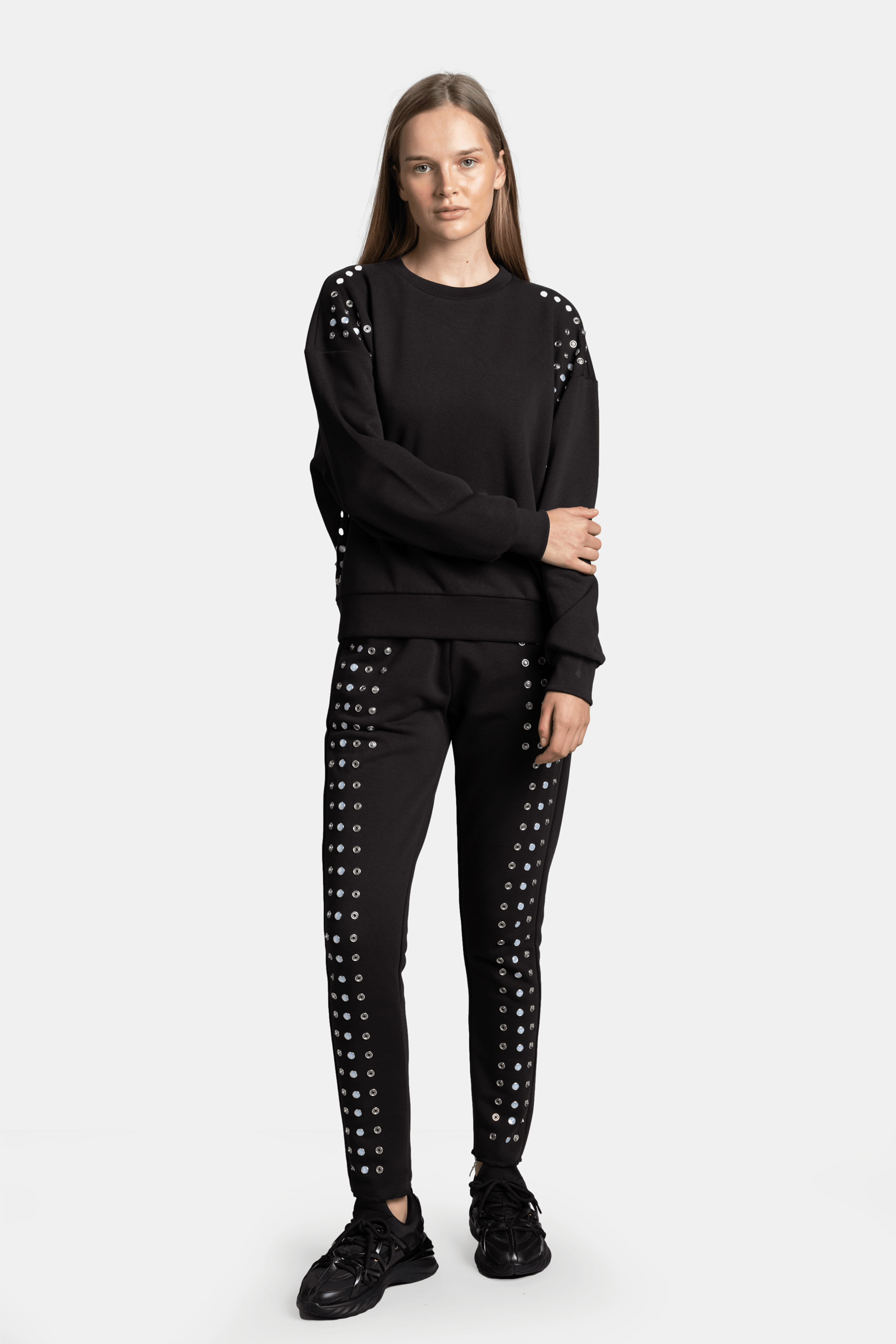 Amaya - Studded Tracksuit Set, detailed view of sweatshirt showing studded pattern on sleeves and shoulders.