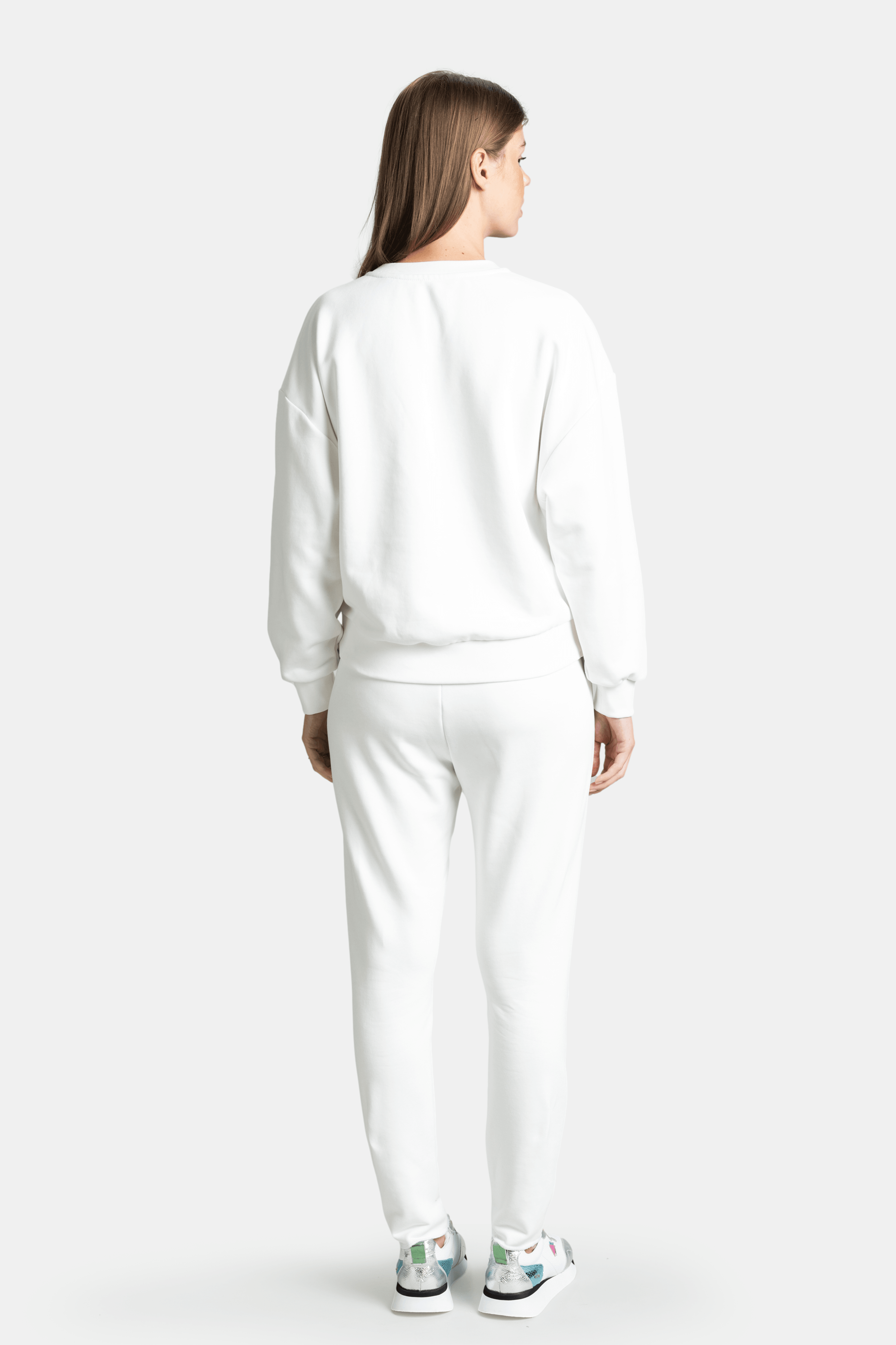 Amaya - Studded Tracksuit Set in Ecru, back view showcasing the simple, studded design on the back.