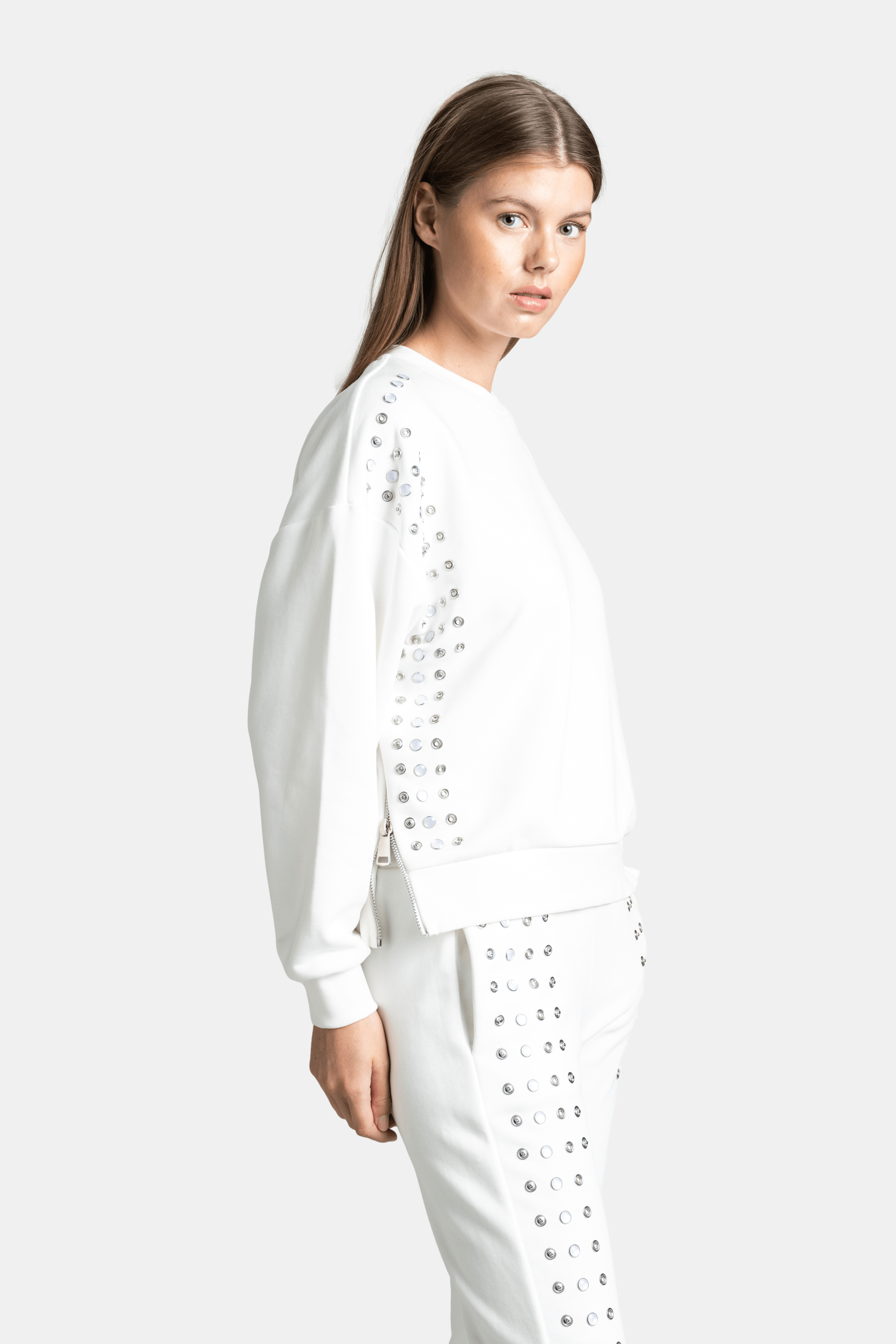 Amaya - Studded Tracksuit Set in Ecru, close-up side angle focusing on shoulder and arm stud details.