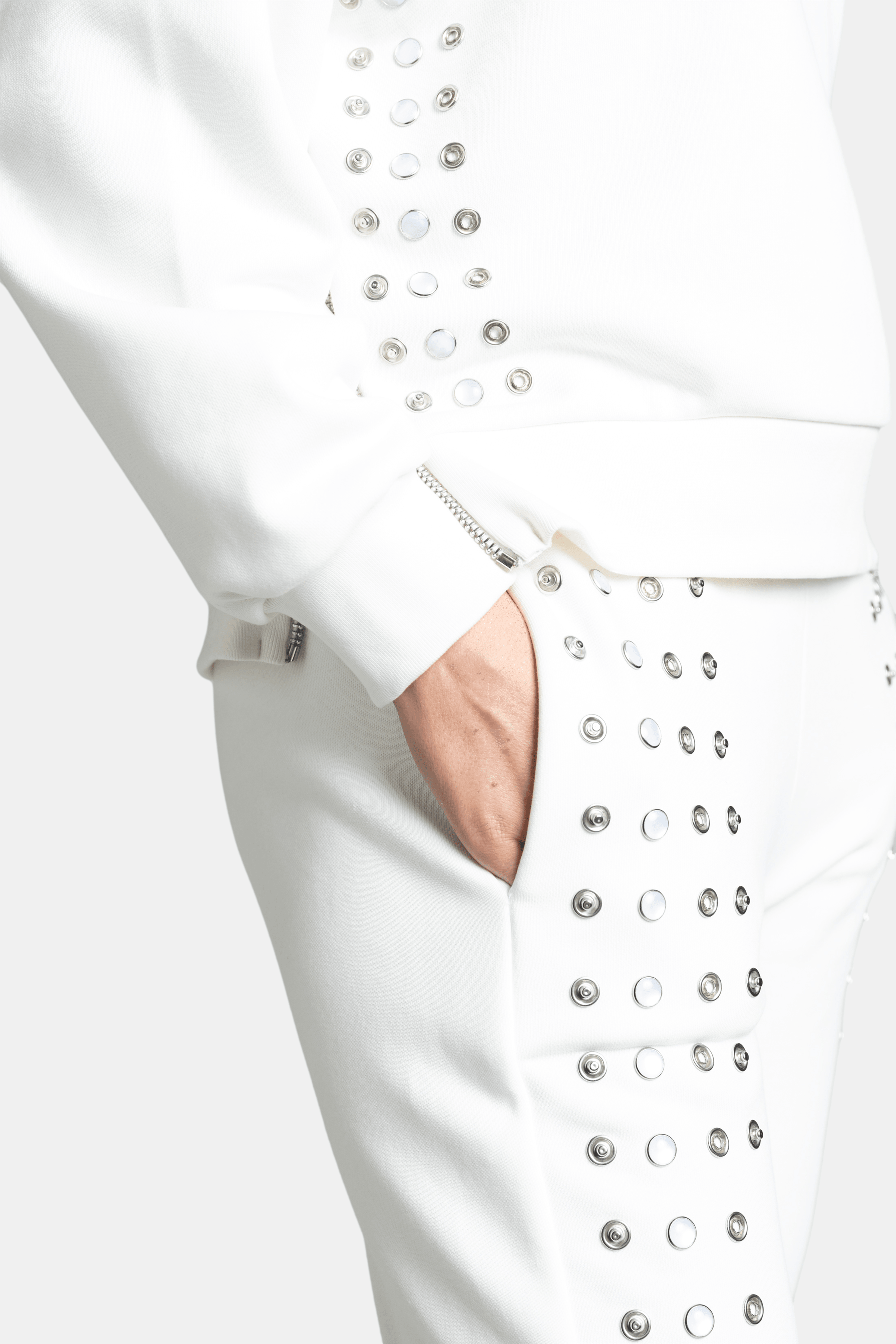 Amaya - Studded Tracksuit Set in Ecru, close-up of pocket and stud detailing on the pants.