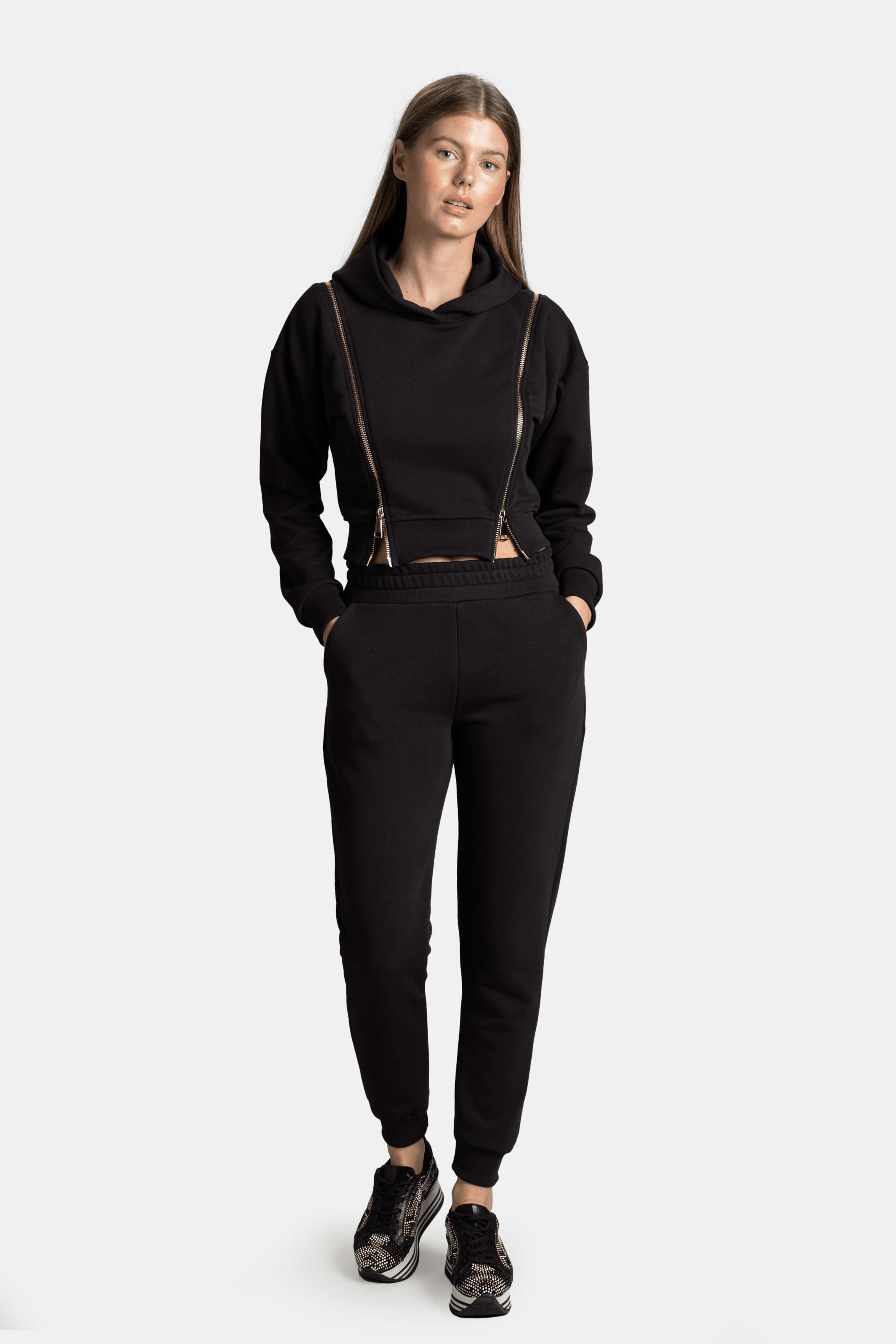 Front view showing the Amina - Zip Detail Tracksuit Set in black with stylish zipper accents