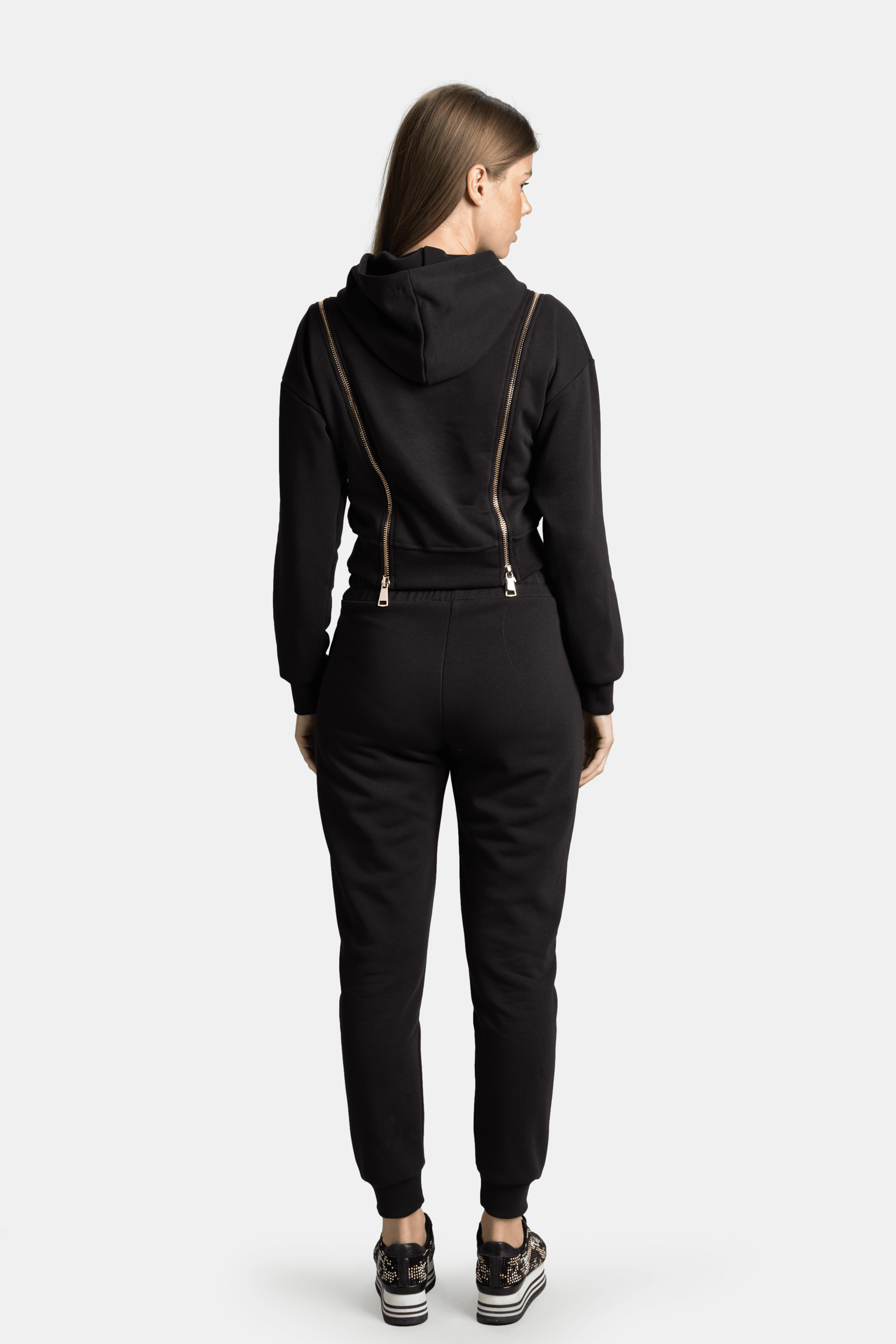 Back view of the Amina - Zip Detail Tracksuit Set in black, highlighting the unique zipper design