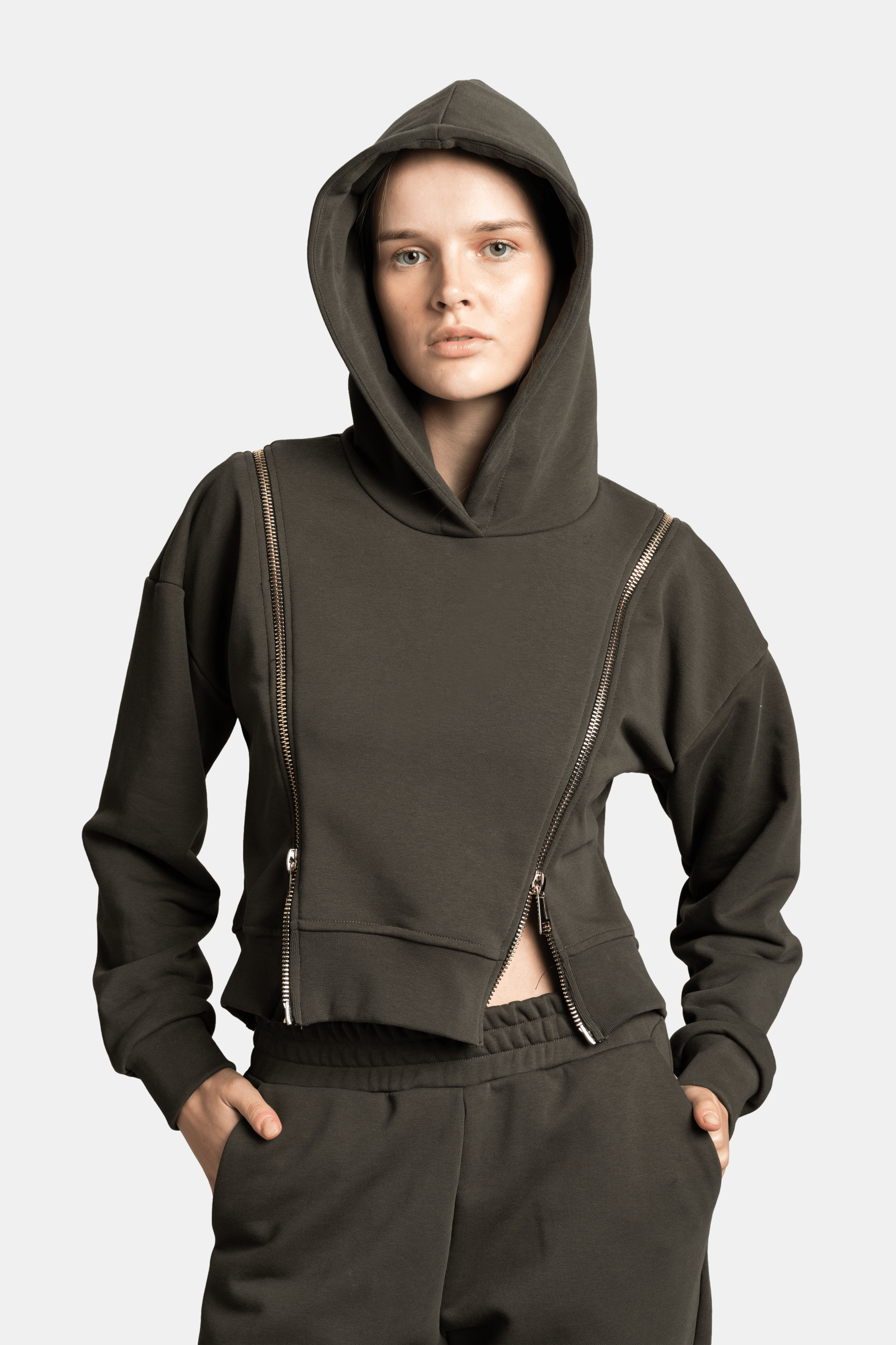 Front view of the Amina - Zip Detail Tracksuit Set in khaki, highlighting the zip detail and relaxed fit around the shoulders and chest.