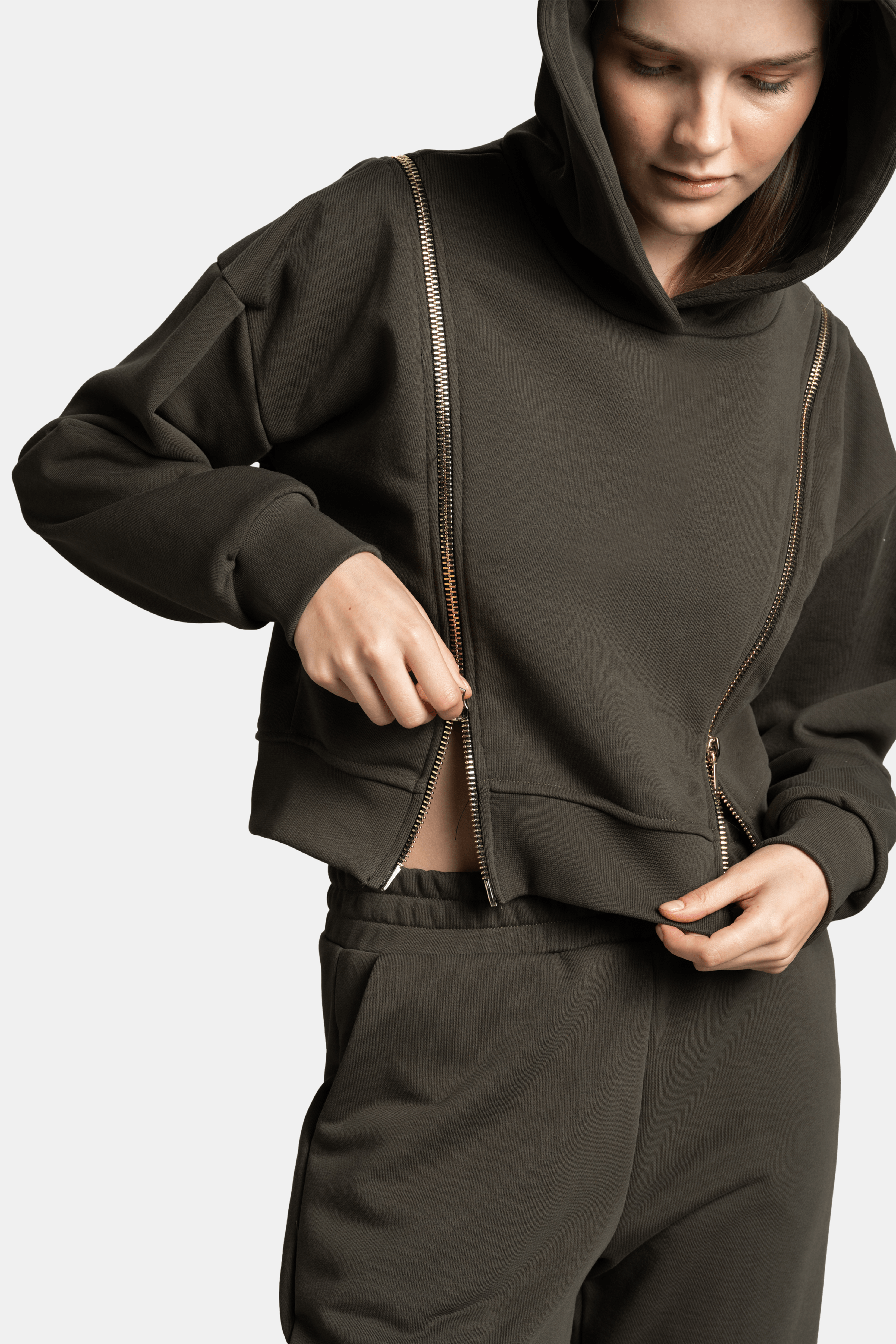 Detailed shot of the zip on the Amina - Zip Detail Tracksuit Set in khaki, showing the functionality and stylish design of the hoodie.