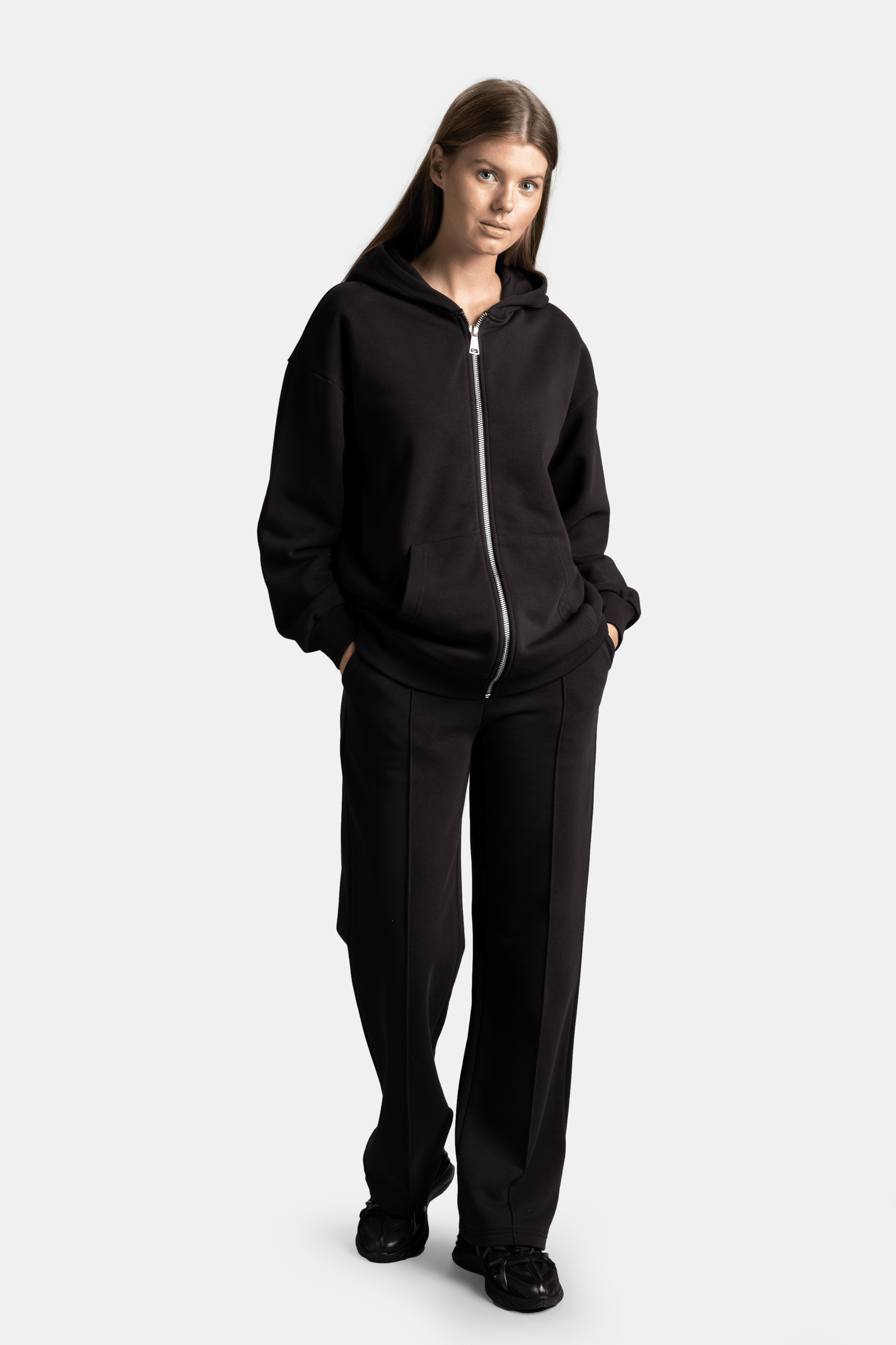 Brianna - Zipper Tracksuit Set in Black - Front view showcasing full zip-up hoodie and relaxed-fit pants