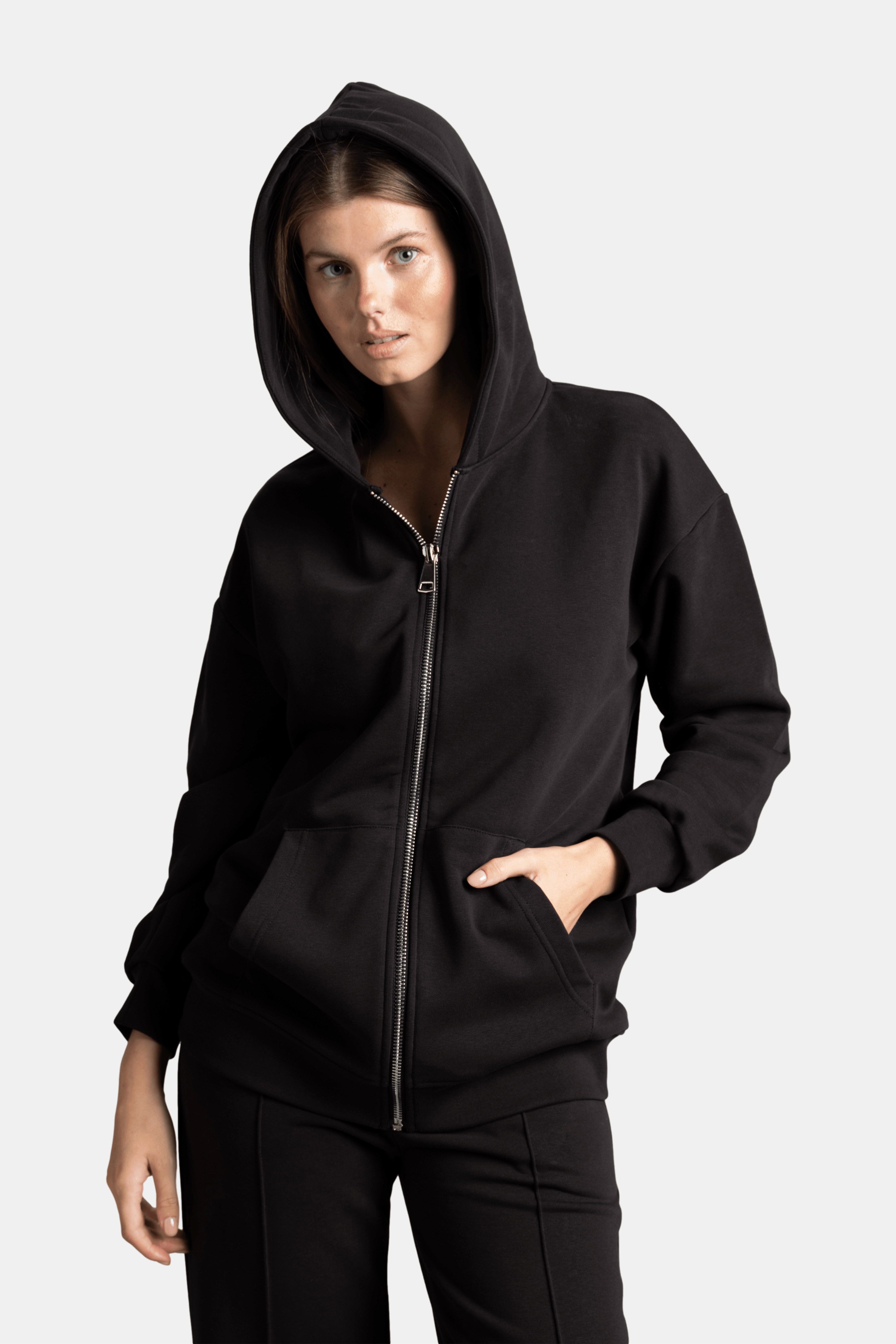 Brianna - Zipper Tracksuit Set in Black - Close-up of the hoodie front with zipper and pocket detail