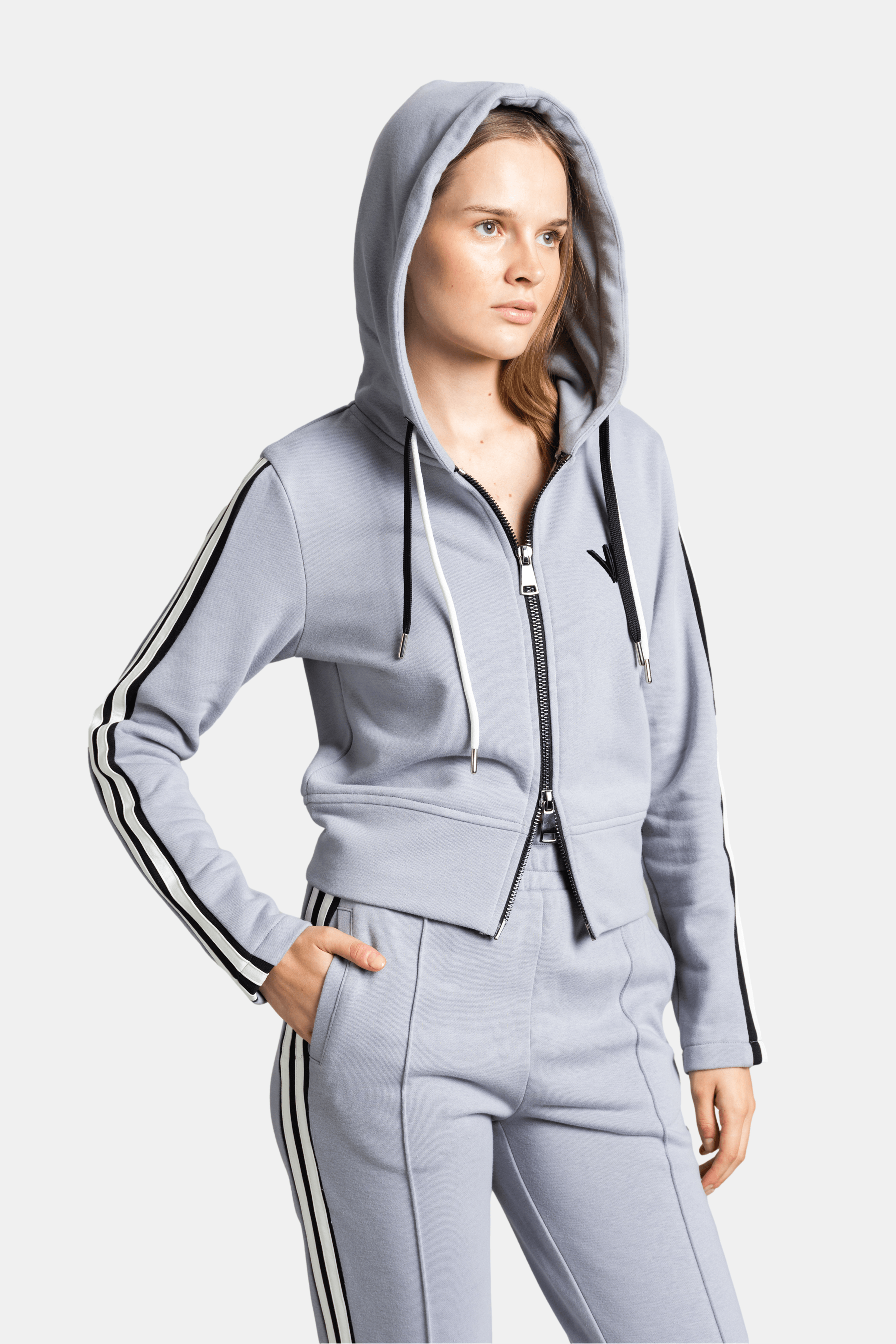 Callista - Sporty Zipper Tracksuit Set in Gray, side view of hoodie worn up, accentuating the sporty aesthetic.