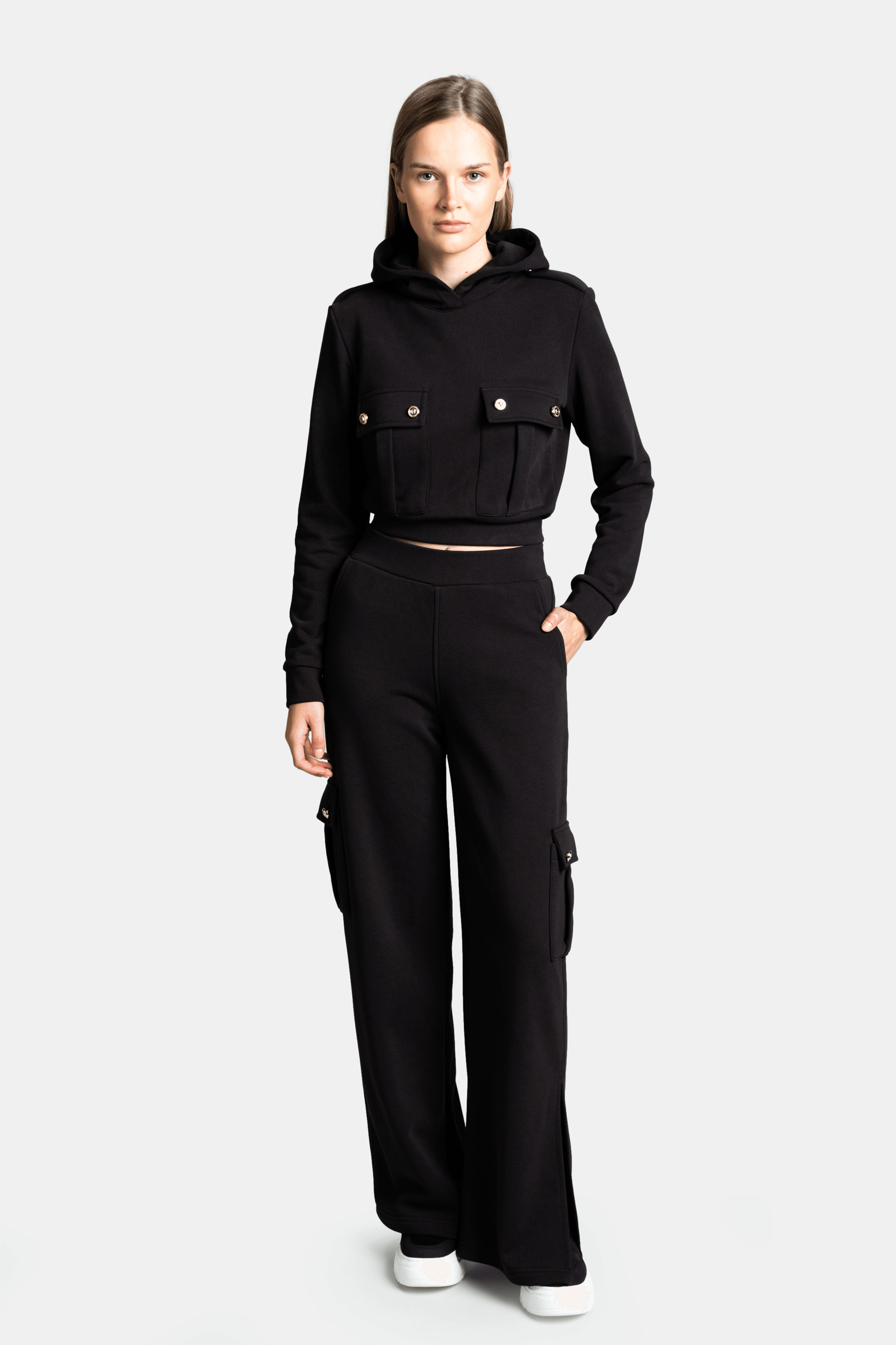 Cambria - Pocket Detail Tracksuit Set in Black, front view showcasing the stylish crop hoodie with flap pockets and wide-leg pants with side cargo pockets, emphasizing the relaxed yet modern look.