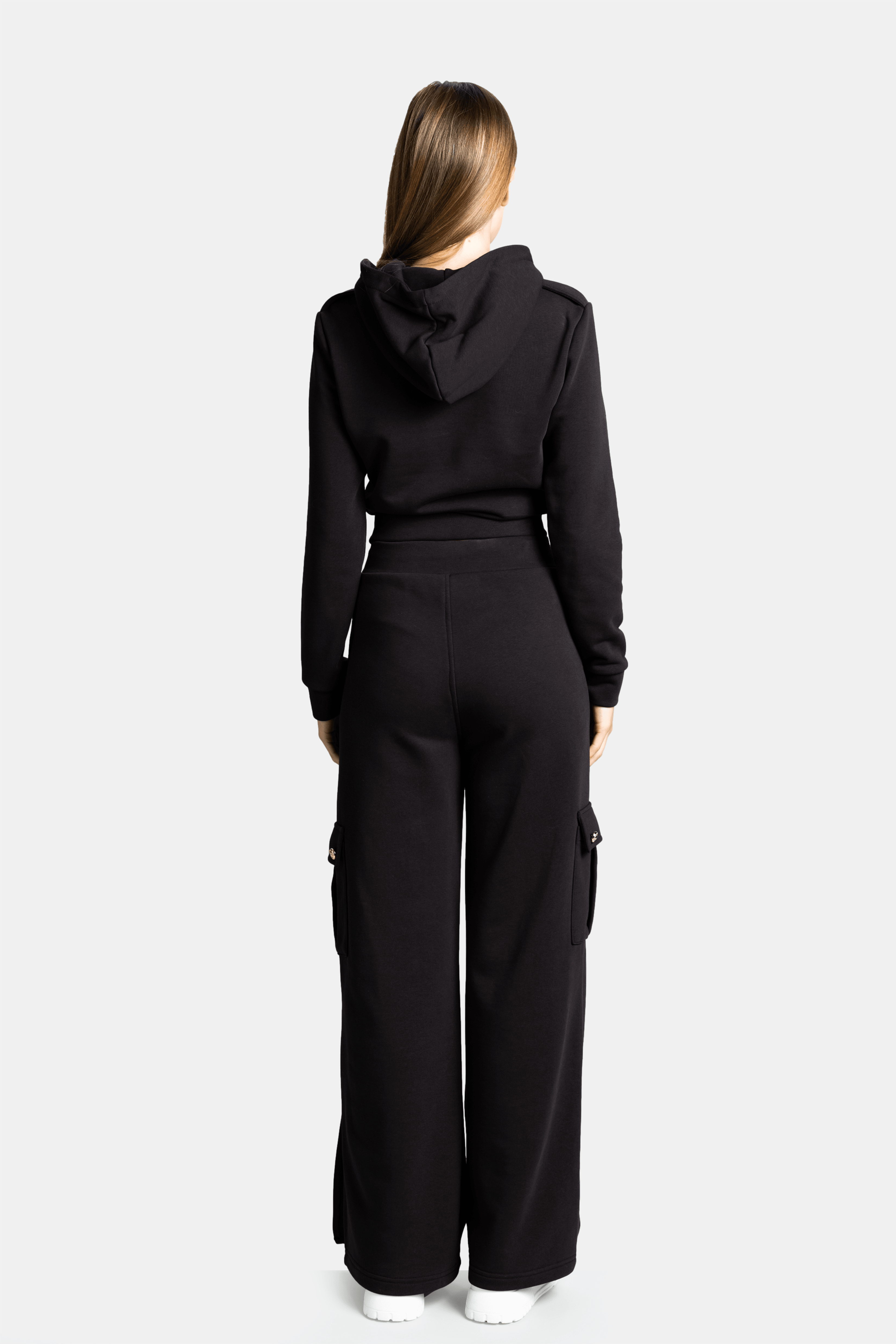 Cambria - Pocket Detail Tracksuit Set in Black, back view highlighting the hooded design and wide-leg silhouette, showcasing a full view of the set’s sleek structure.