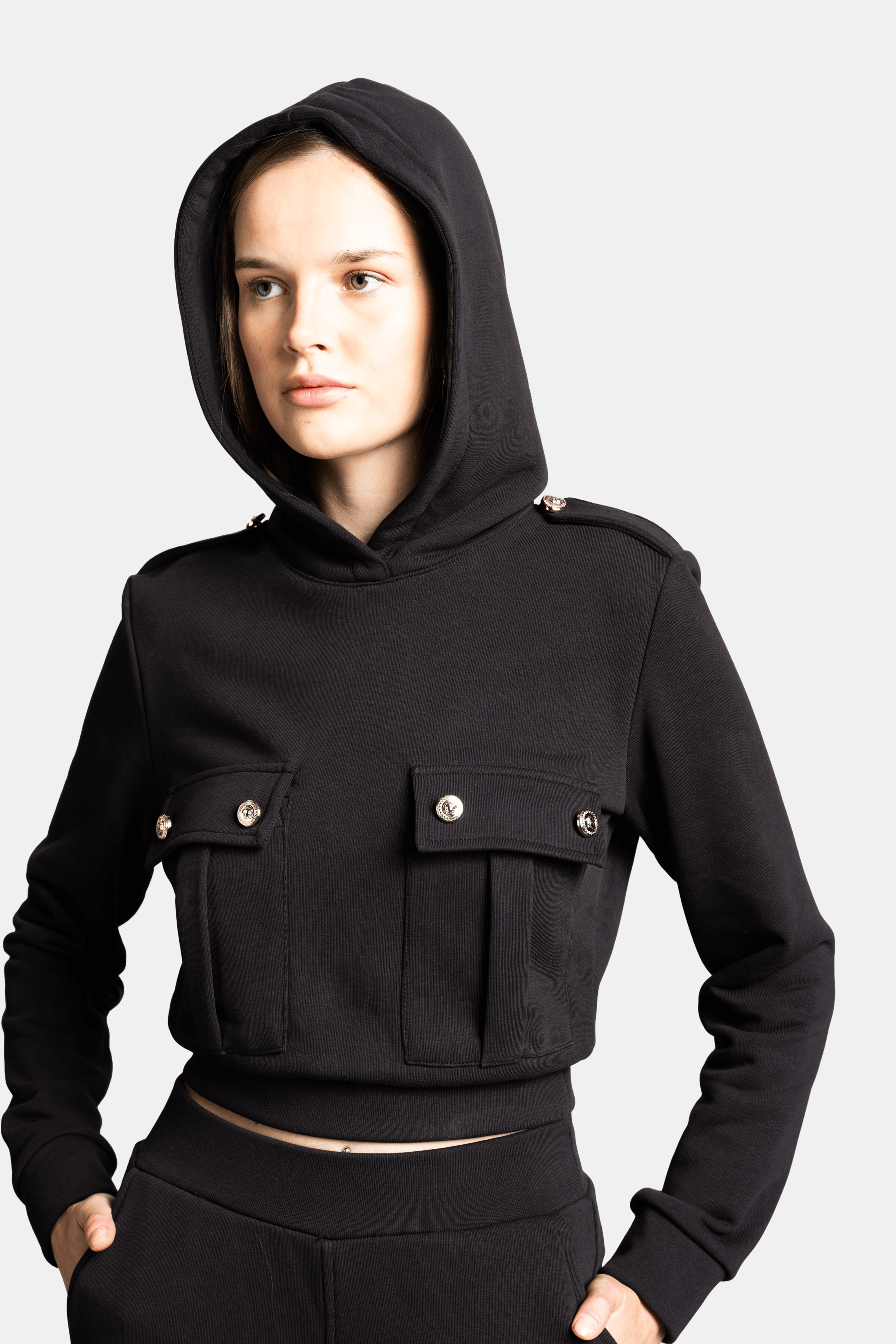 Cambria - Pocket Detail Tracksuit Set in Black, close-up of the hooded crop top showing the flap pocket details and high-quality fabric, ideal for a sporty-chic style.