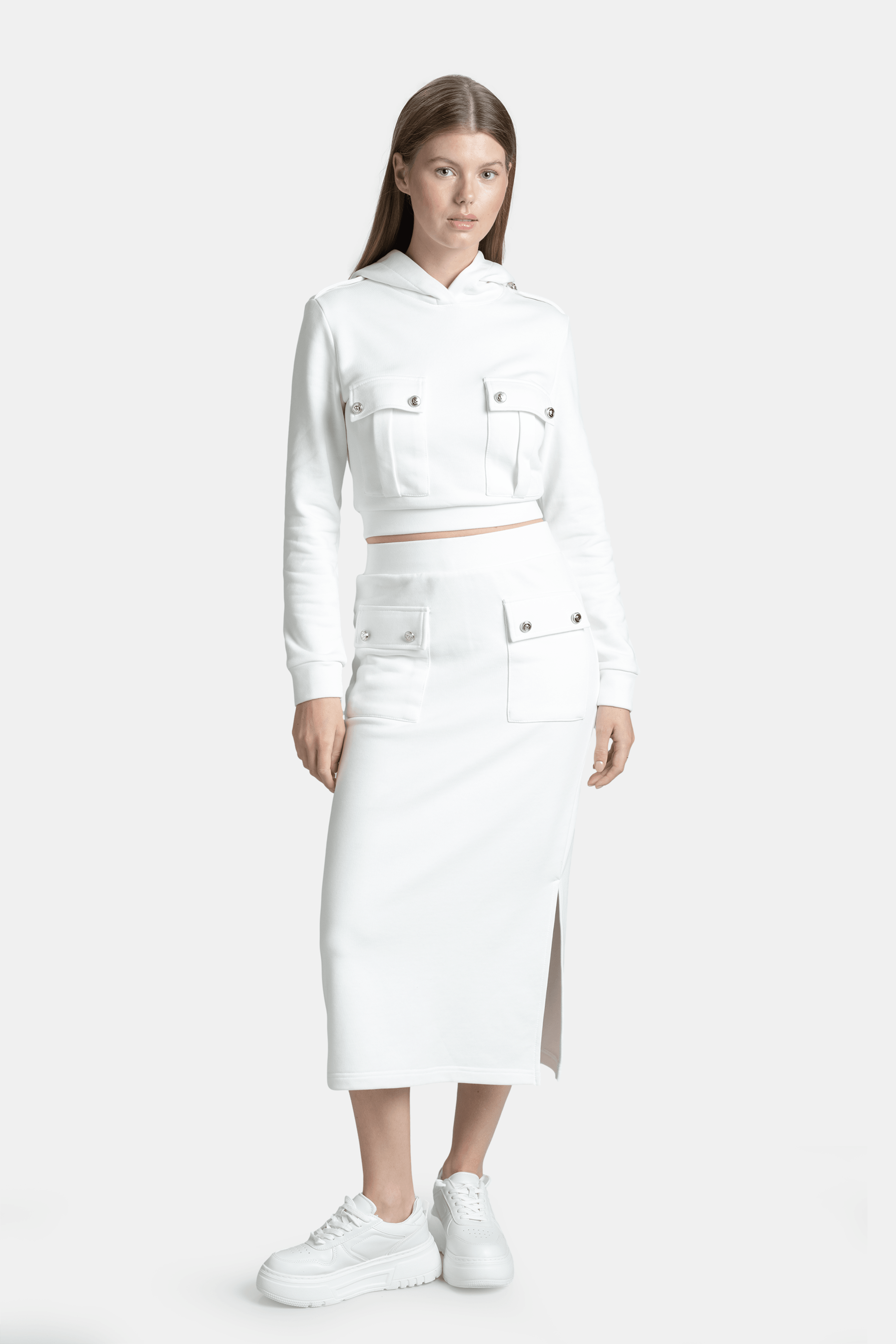 Capri - Pocket Detail Skirt Set in Ecru, front view showing the model in a stylish white hoodie and skirt with buttoned pocket details, focusing on the chic and modern design.