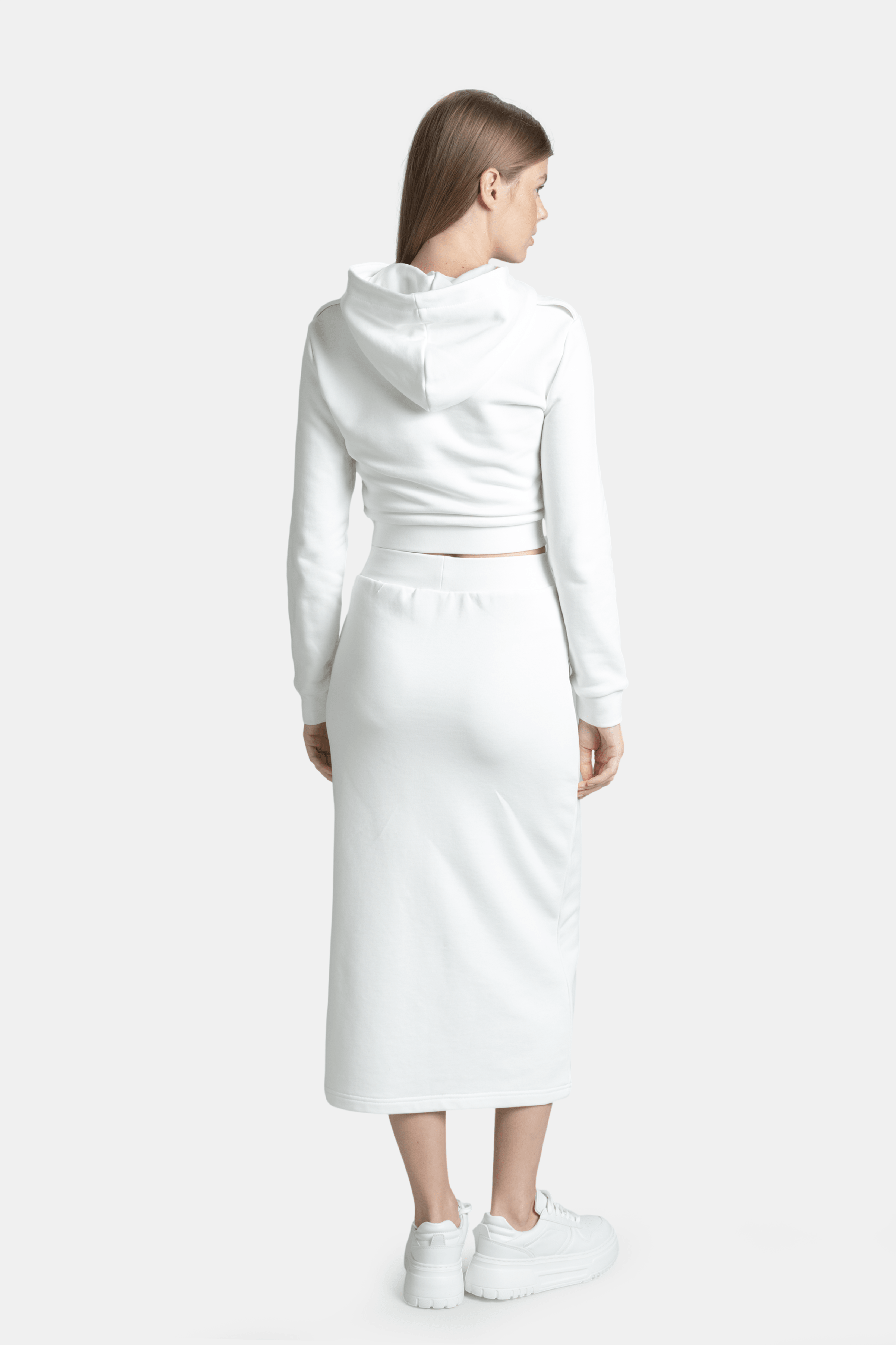 Capri - Pocket Detail Skirt Set in Ecru, back view highlighting the fitted hoodie and skirt ensemble, emphasizing the comfortable and sleek look of the outfit.