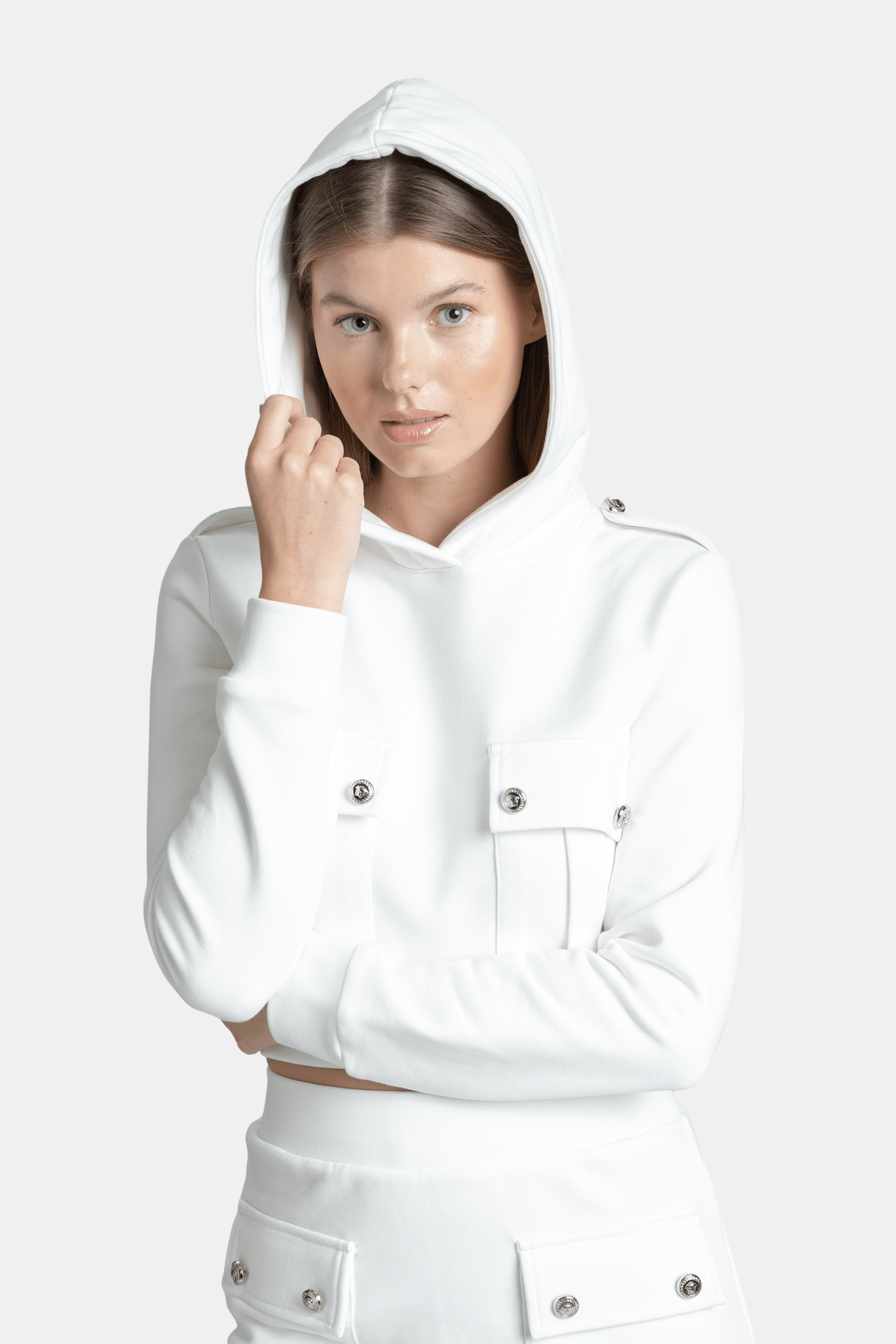 Capri - Pocket Detail Skirt Set in Ecru, close-up of the hoodie with hood up, accentuating the high-quality material and elegant buttoned pocket design.