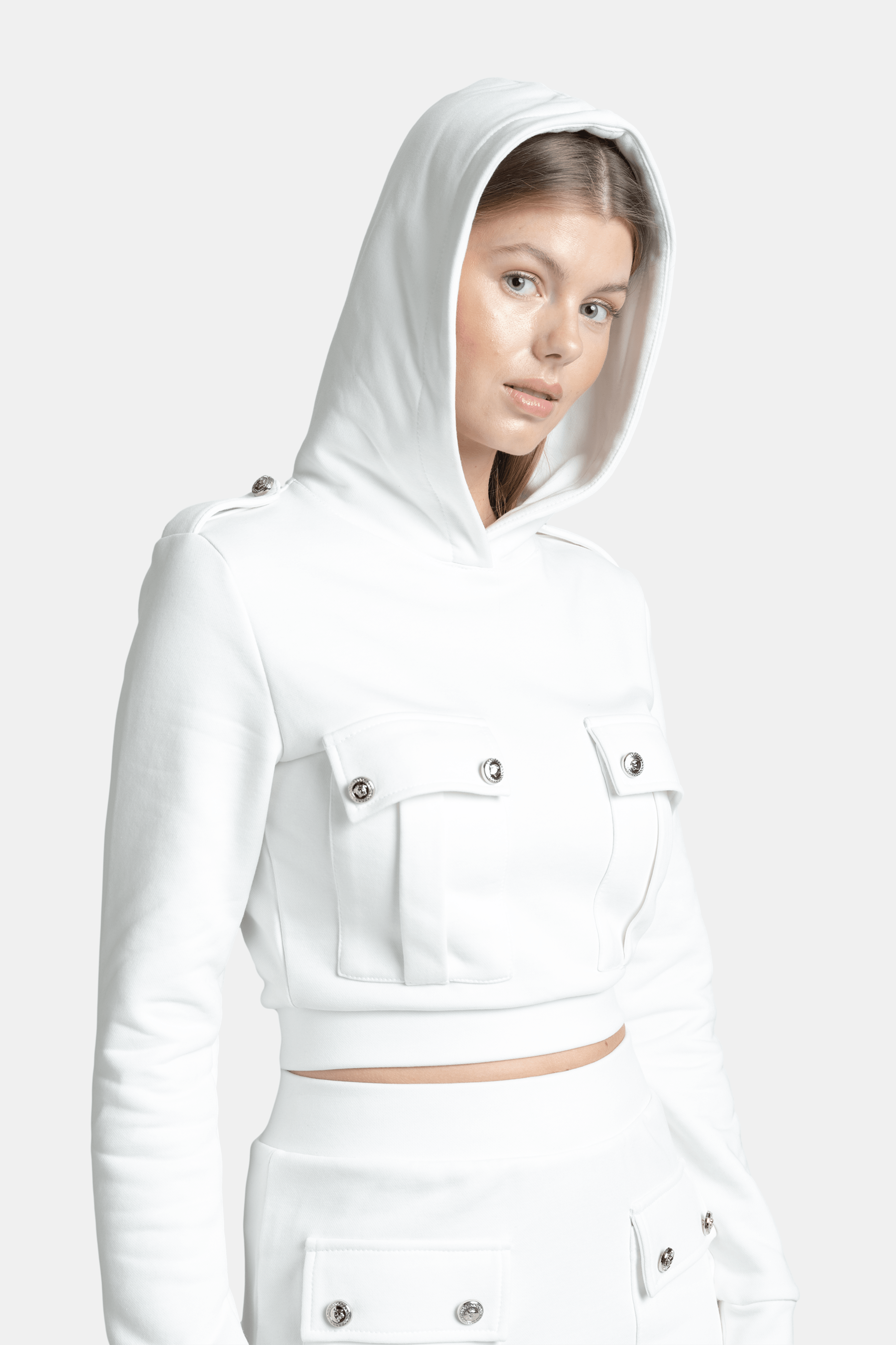 Capri - Pocket Detail Skirt Set in Ecru, side view with hood up, presenting a modern and effortlessly chic look with a focus on the detailed design elements.