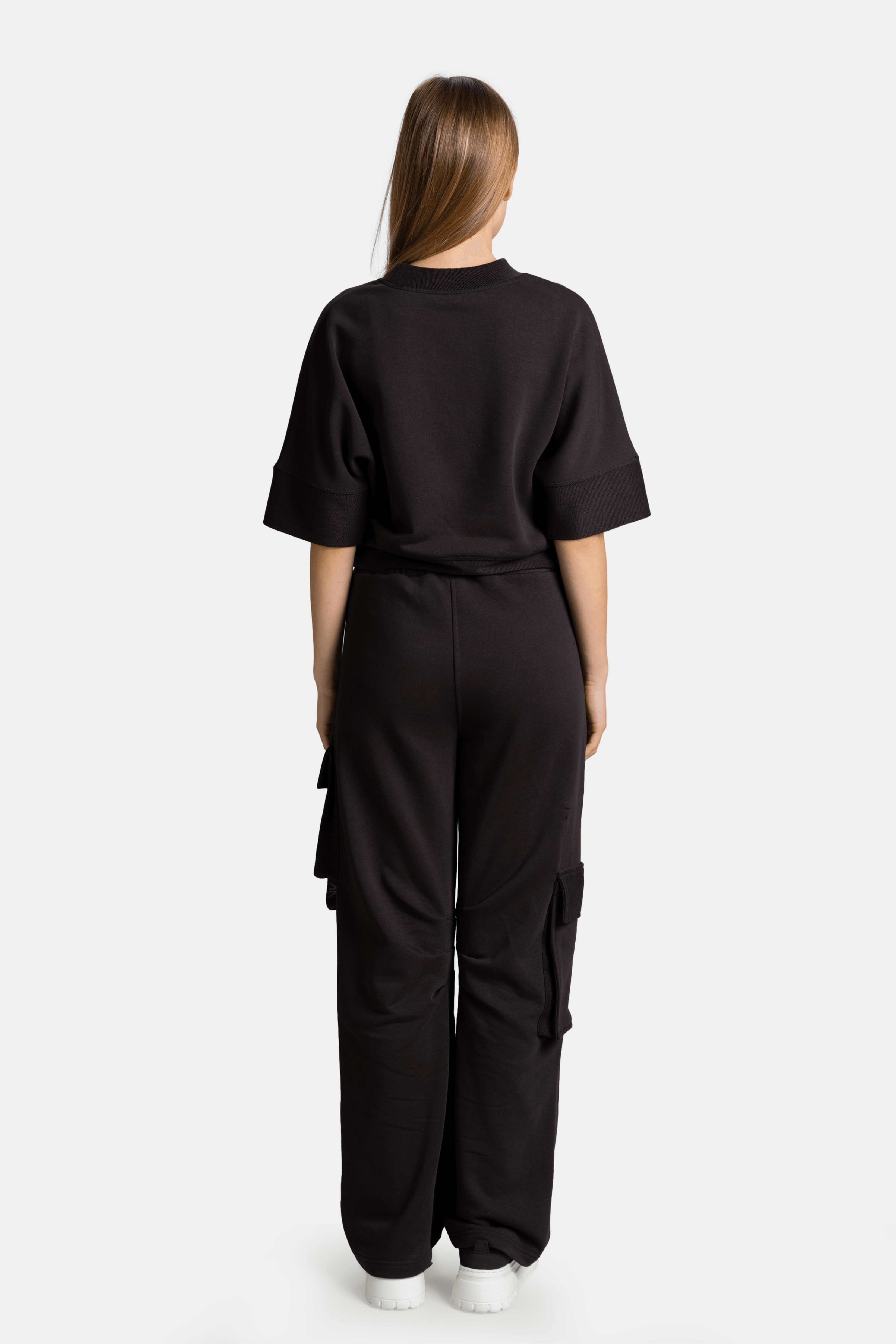 Meira - Cargo Jogger Tracksuit Set in Black, back view presenting the full outfit from behind, emphasizing the relaxed silhouette and high-quality fabric.