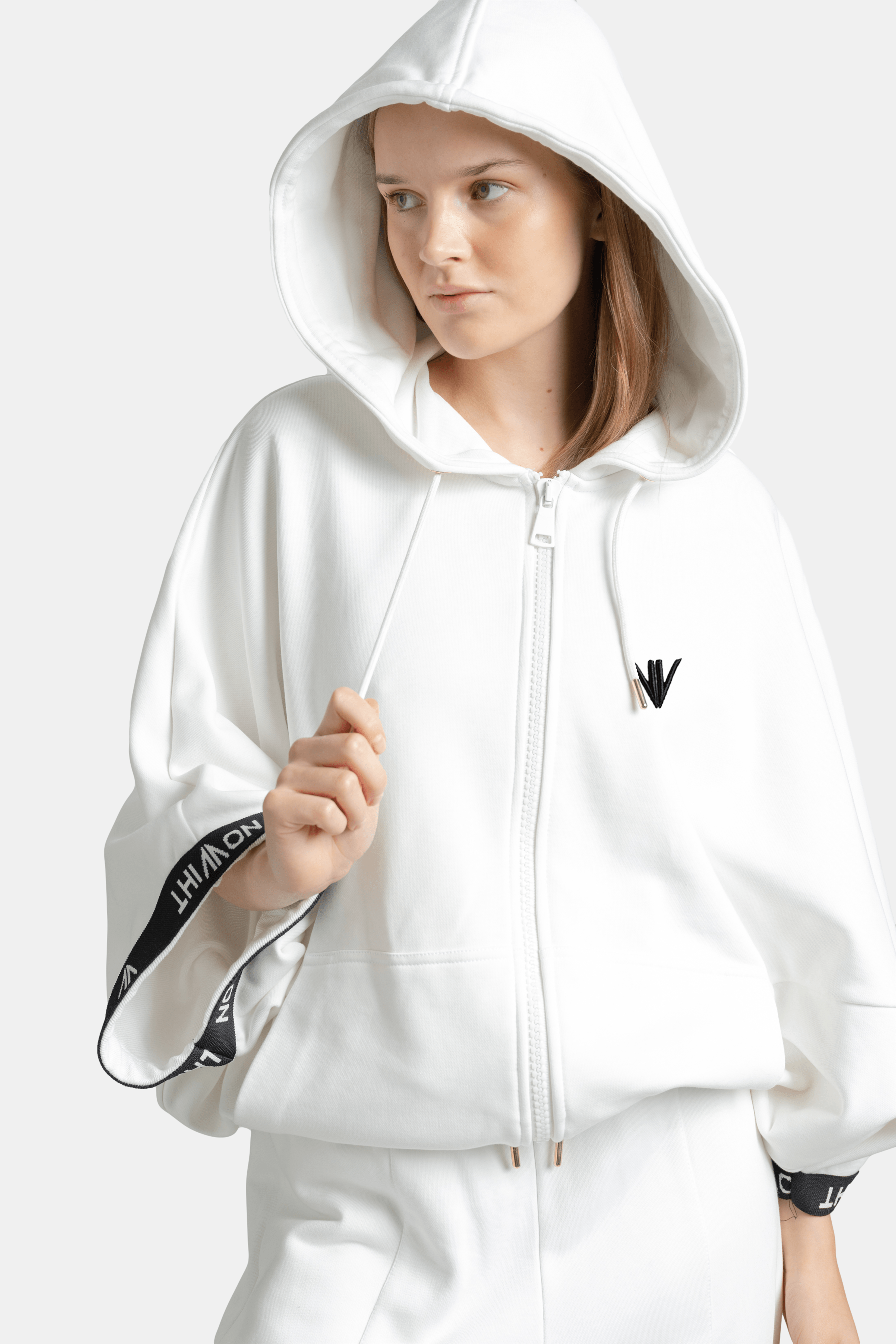 Front-facing look of Elif - Parachute Sleeve Tracksuit Set in White, emphasizing the hood and parachute sleeve detail.