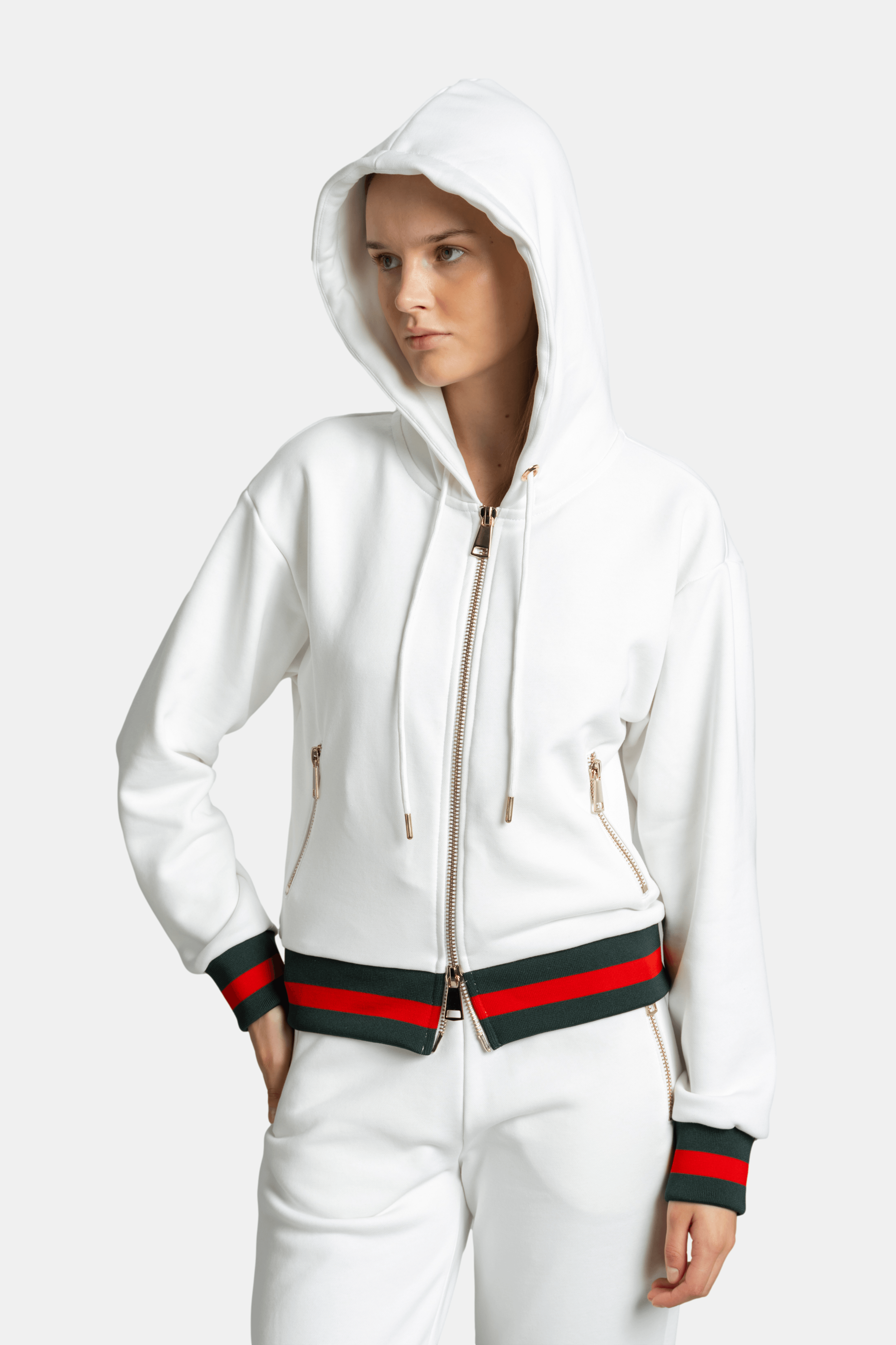 Front close-up of model wearing hood on white Destiny striped zip hoodie tracksuit set