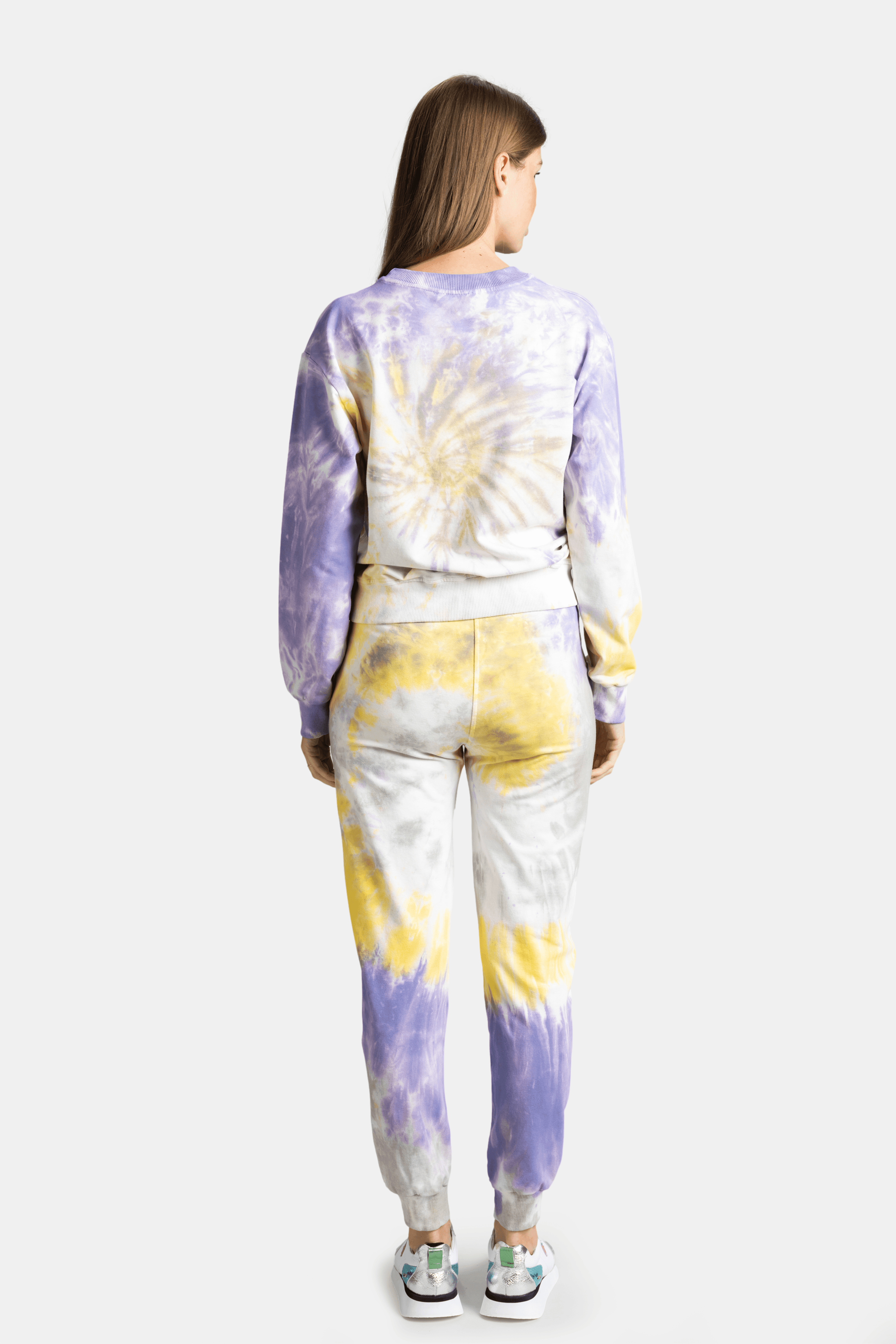 Back view of tie-dye loungewear set in yellow, purple, and white hues, showcasing comfortable fit and unique color pattern for a bold fashion statement.