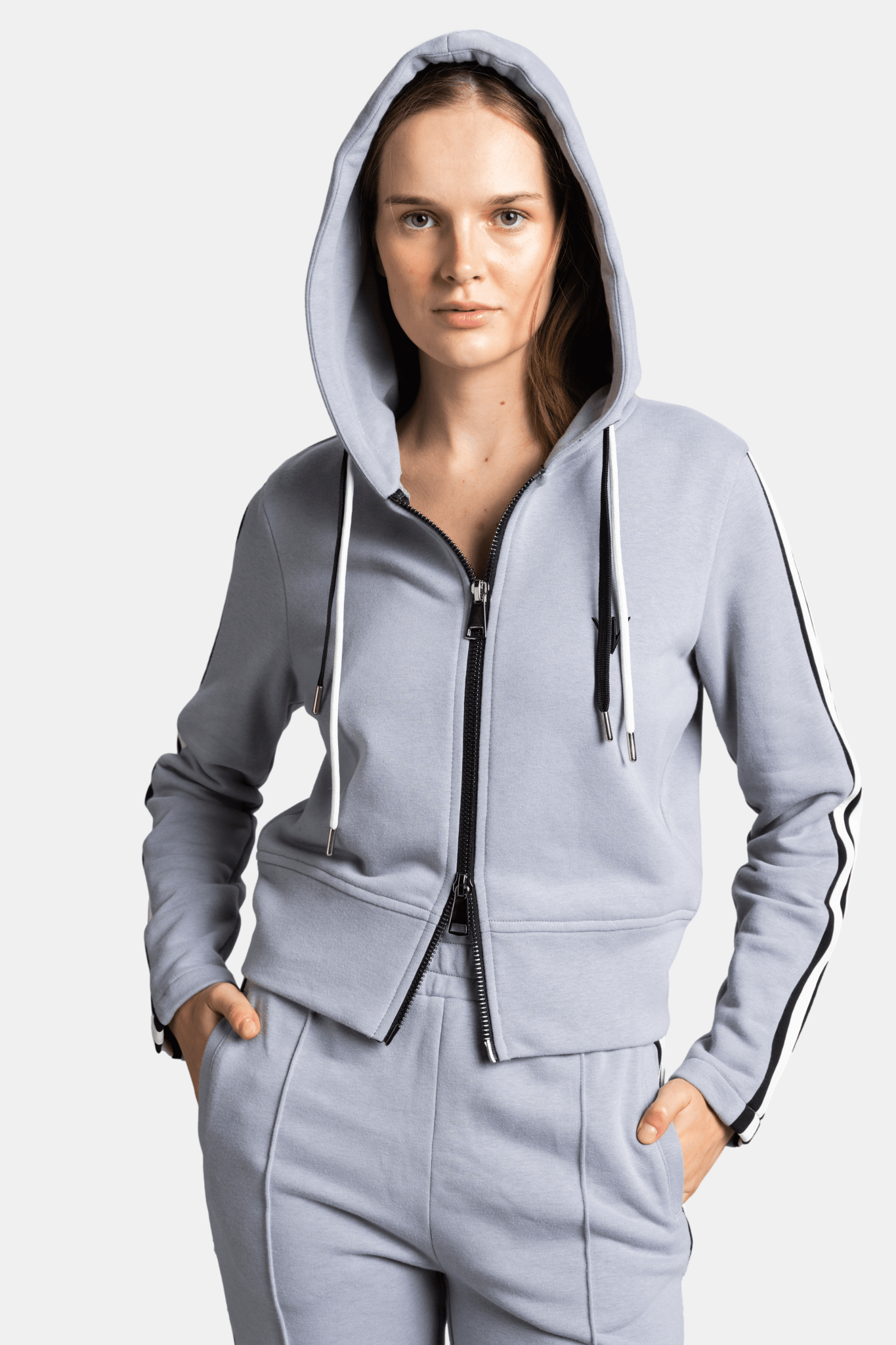 Callista - Sporty Zipper Tracksuit Set in Gray, close-up of the hoodie with zipper and stripe detail for a stylish look.